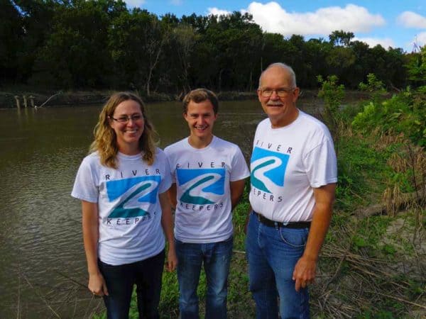 people standing by the river in River Keepers t-shirts